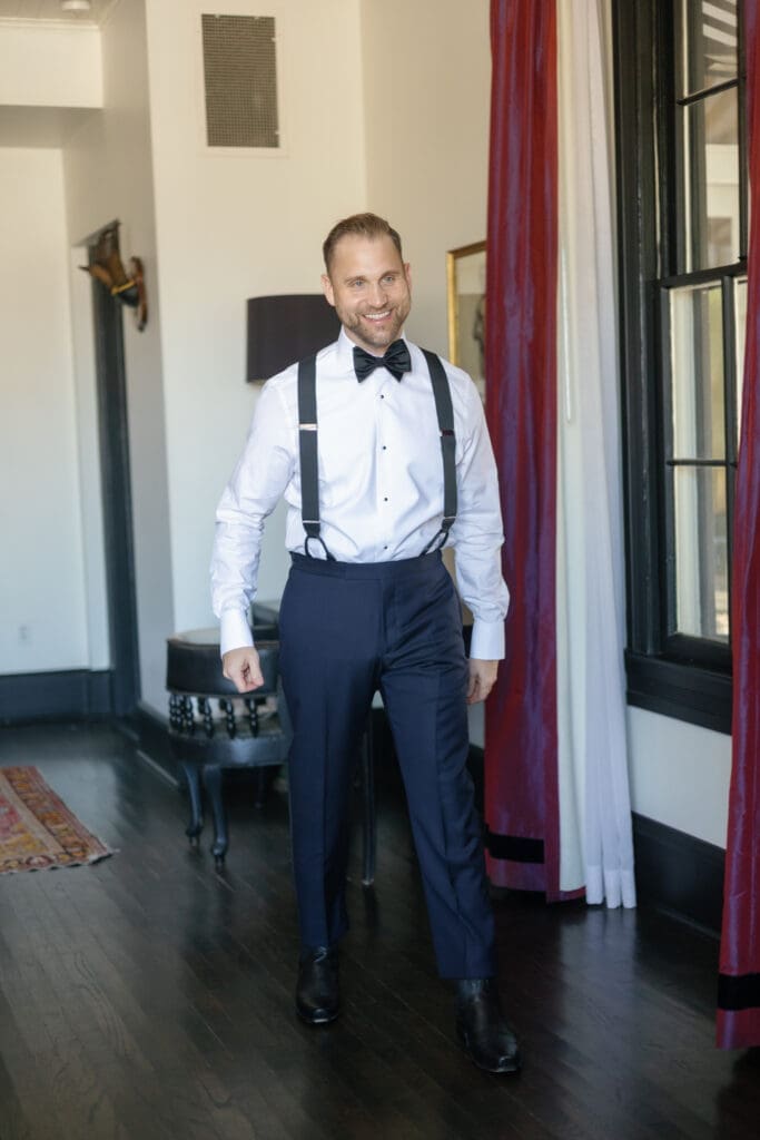 Groom getting ready inside The Hotel St. Cecilia before the wedding ceremony.