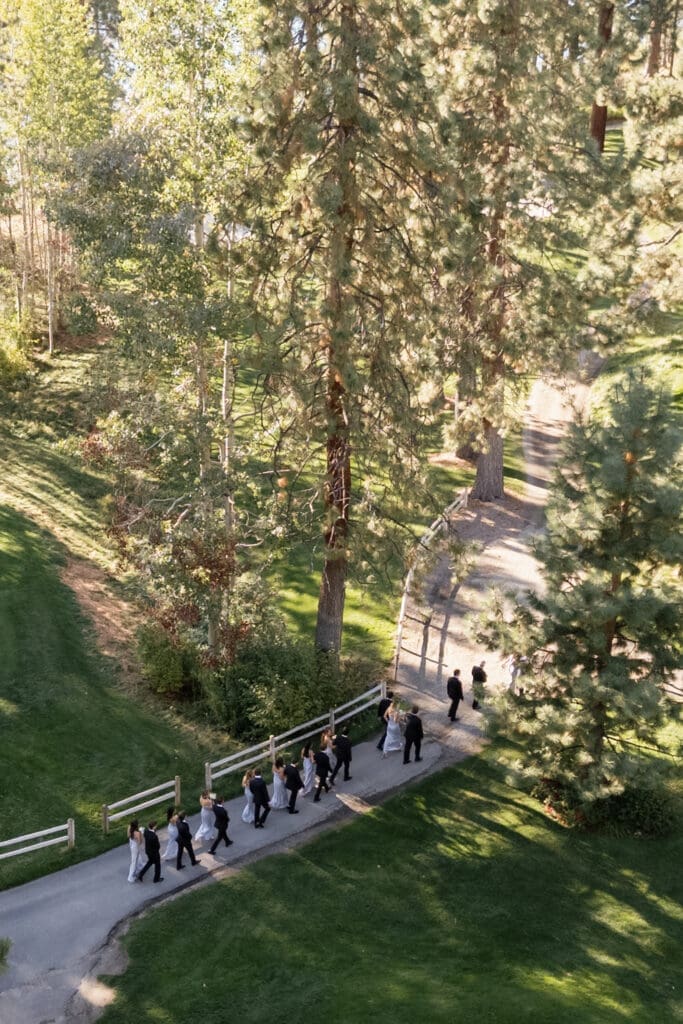 Bride and wedding party laughing together in Lot B during an Edgewood Tahoe wedding day timeline before the ceremony.