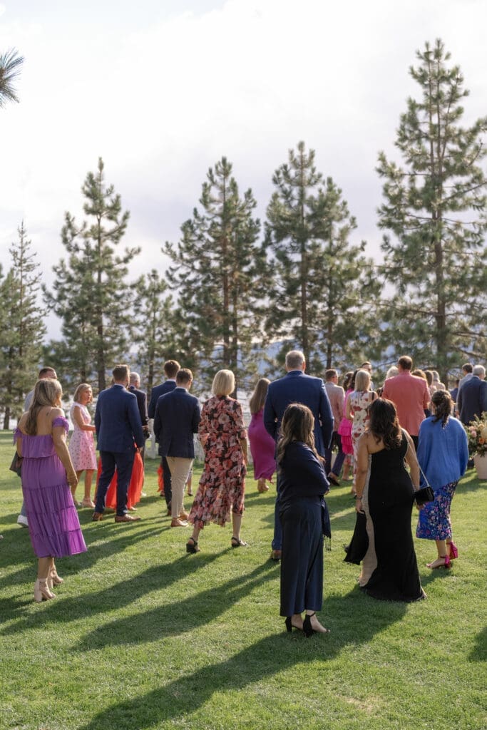 Wedding guests gathering on the lawn during cocktail hour at Edgewood Lake Tahoe.