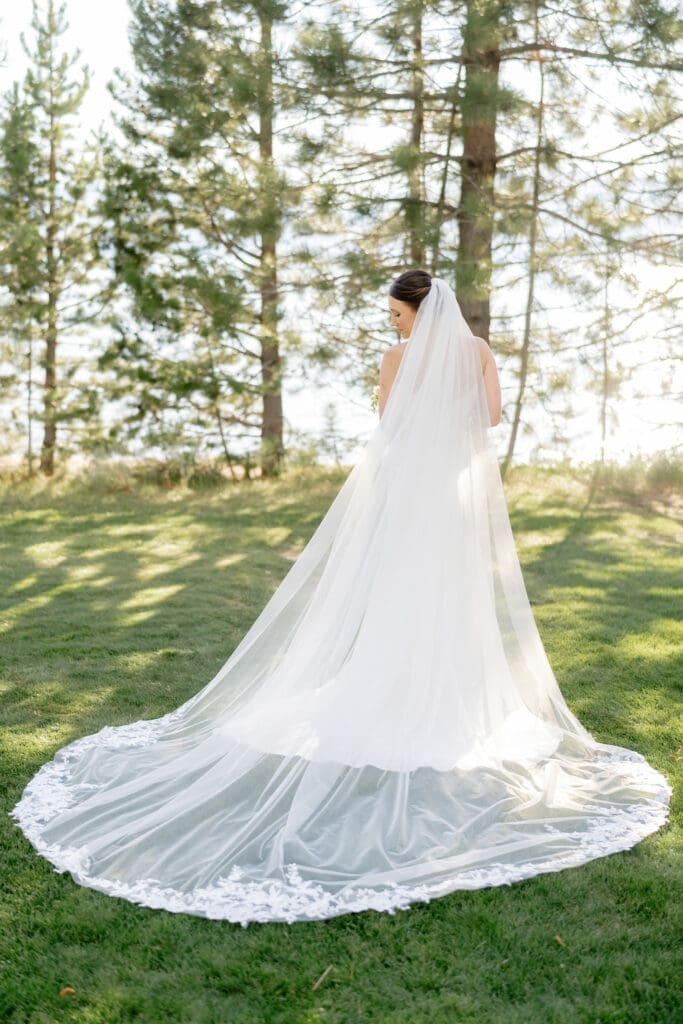 Bridal portrait beneath the pine trees overlooking Lake Tahoe at Edgewood Resort.