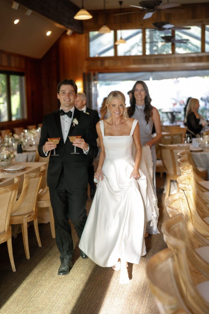 Bride and groom entering the reception at Glenbrook Club during a Lake Tahoe wedding celebration.