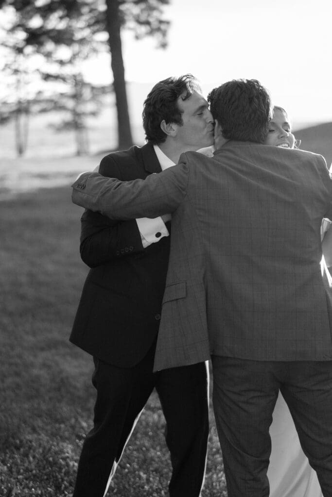 Couple embracing family members during cocktail hour at Edgewood Resort.