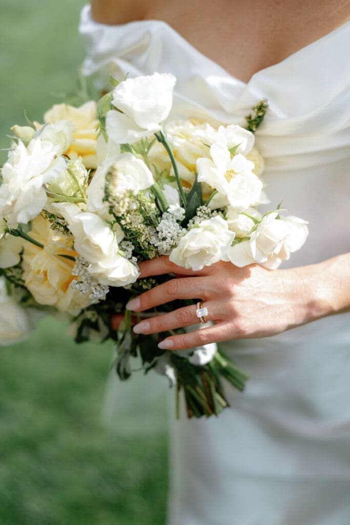 Bride holding a white floral bouquet during an Edgewood Tahoe wedding at the 17th Green