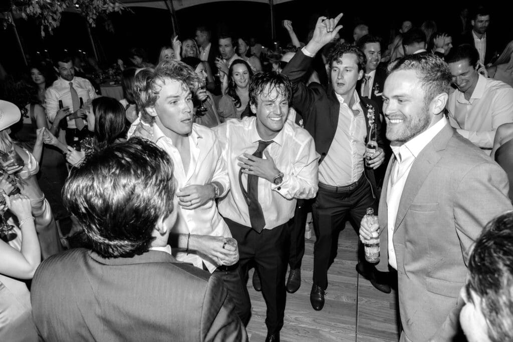 A candid wedding day timeline moment during the reception celebration at Edgewood Tahoe’s 17th Green overlooking Lake Tahoe.