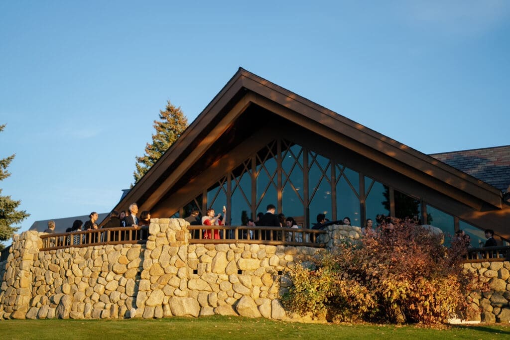 Edgewood Lake Tahoe clubhouse and terrace overlooking the golf course during a wedding reception.