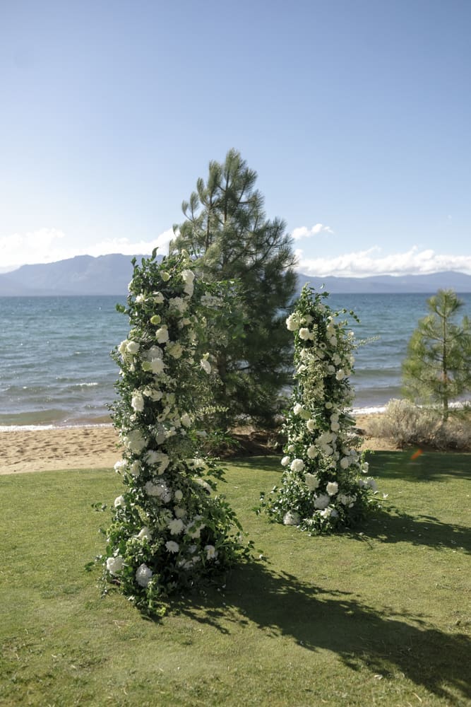 Floral ceremony arch overlooking Lake Tahoe at Edgewood Resort.