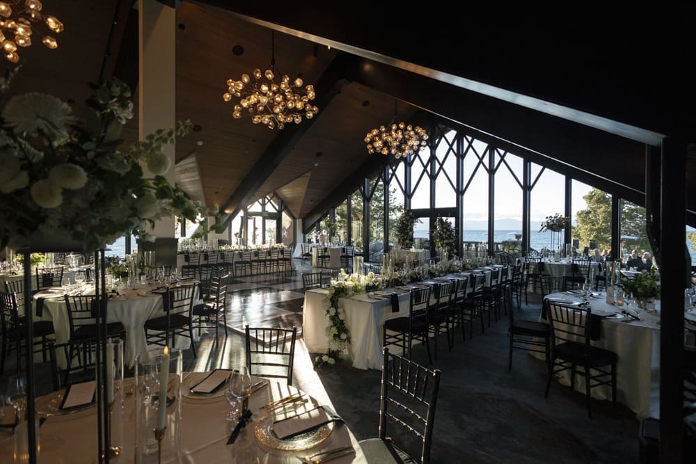 Reception setup inside the Edgewood Resort Lake Club with panoramic views of Lake Tahoe.