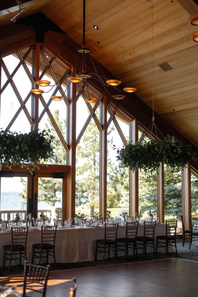 Reception space inside the Edgewood Resort Lake Club with floor-to-ceiling lake views.