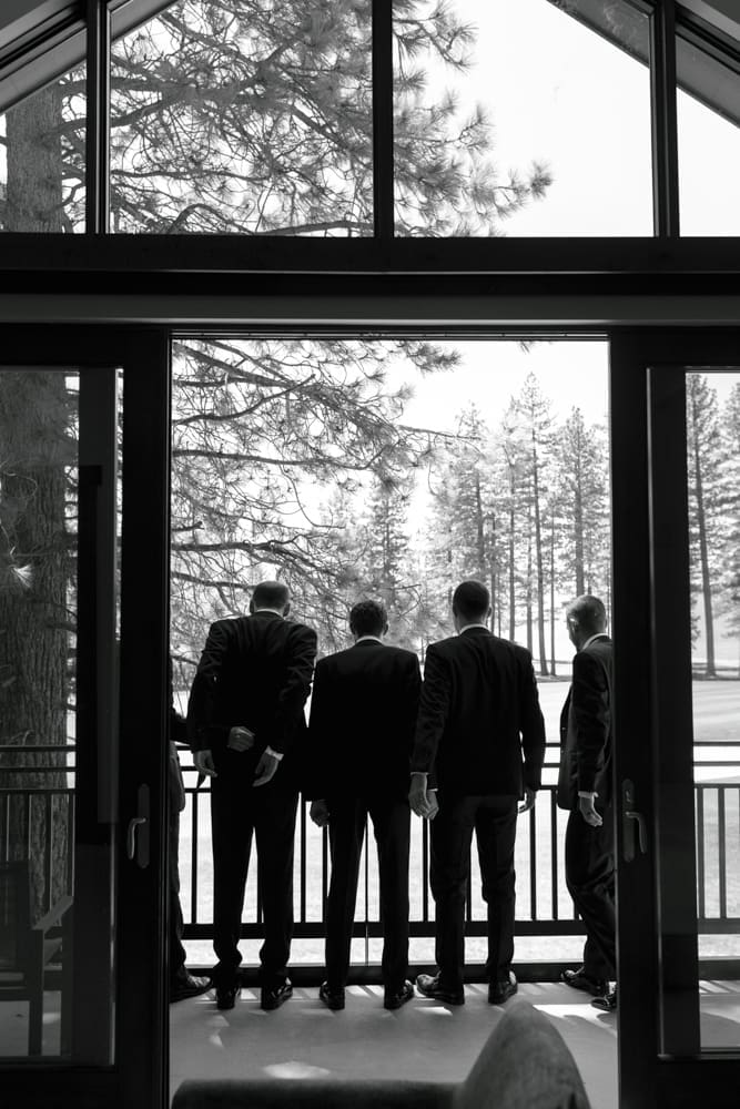 Groomsmen overlooking Lake Tahoe from the balcony at Edgewood Resort before the wedding ceremony.