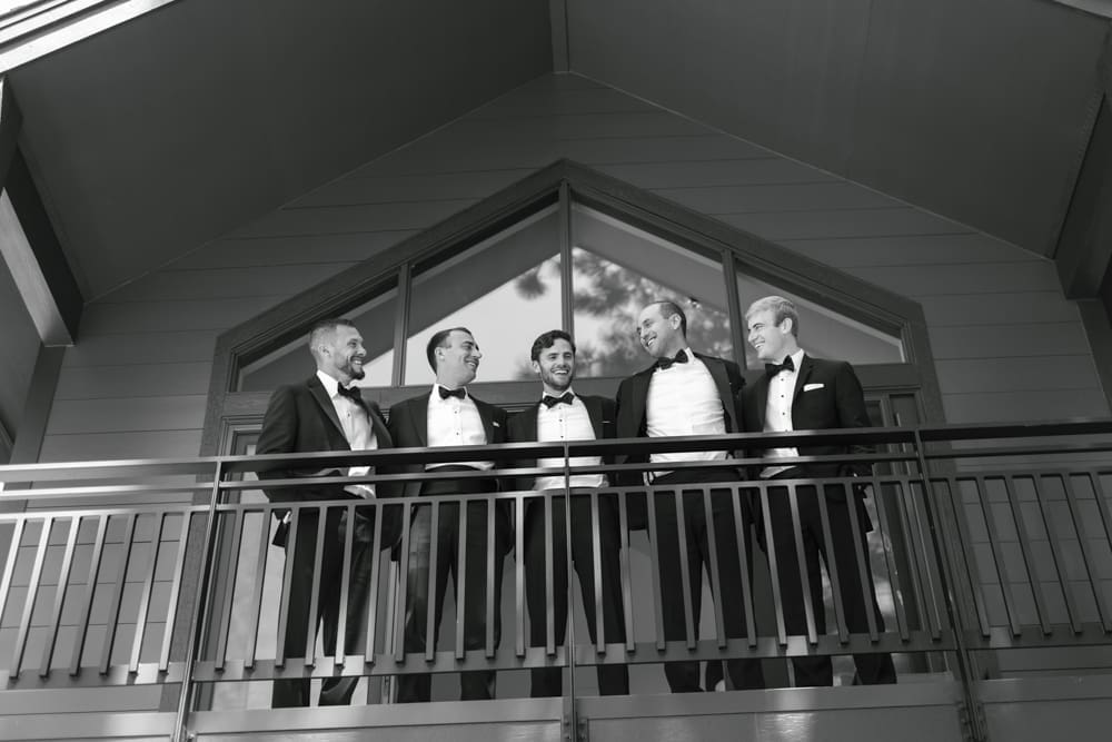 Groom and groomsmen gathered on the balcony at Edgewood Resort before the wedding ceremony.