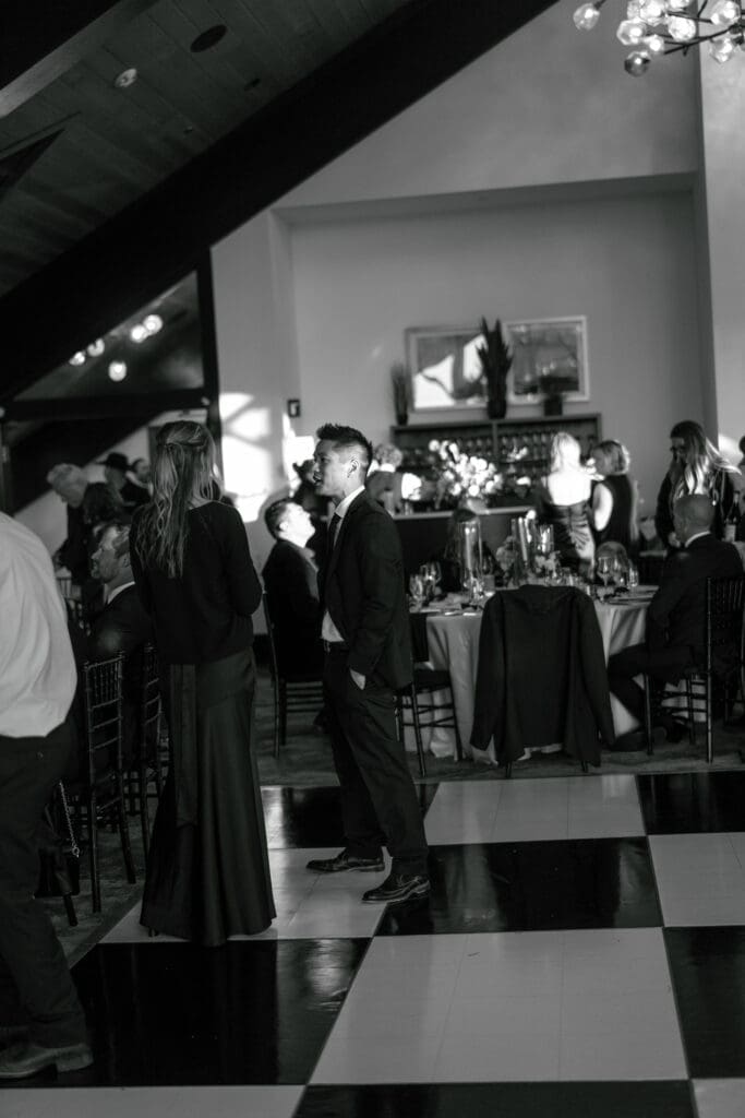 Guests dancing on the checkered dance floor inside the Edgewood Resort Lake Club.