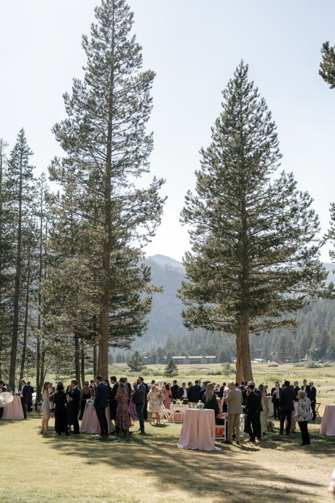 Wedding guests during cocktail hour at Everline Resort in Olympic Valley
