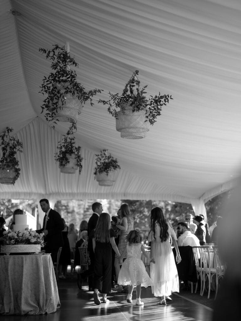 Guests gathering beneath a reception tent during an Everline Resort wedding celebration