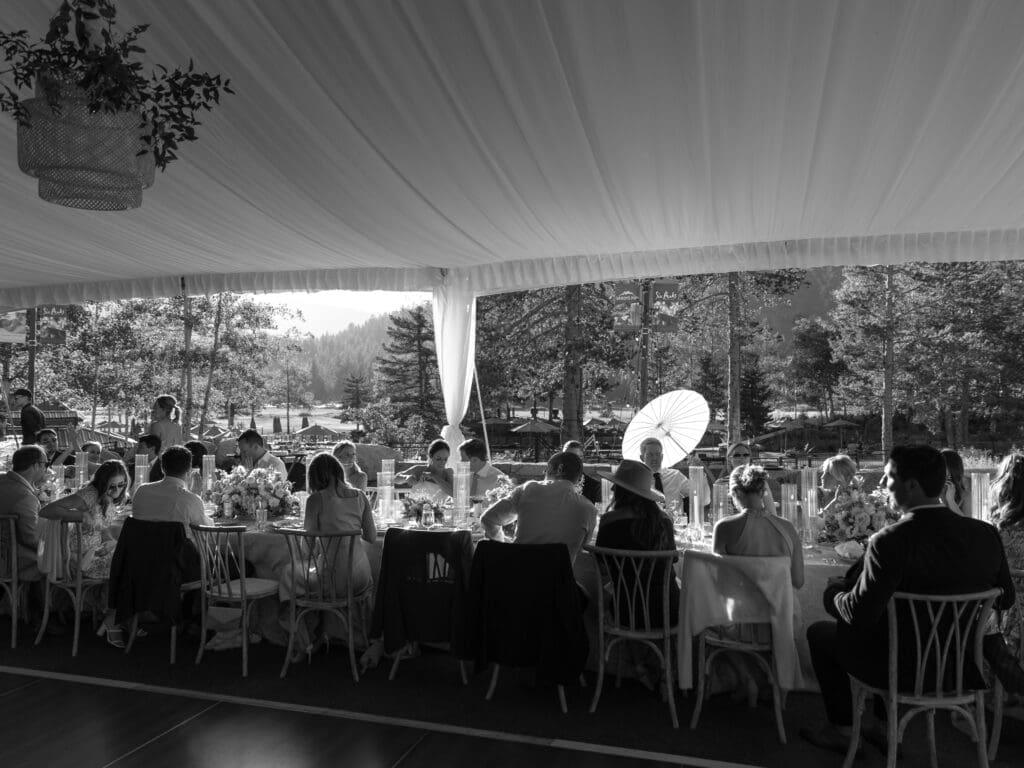 Outdoor wedding reception beneath a white tent at Everline Resort Lake Tahoe