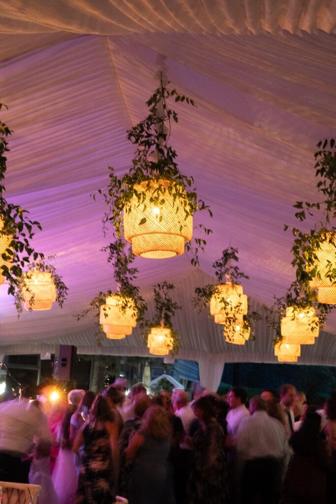 Reception dance floor beneath hanging woven lanterns during an Everline Resort Lake Tahoe wedding reception