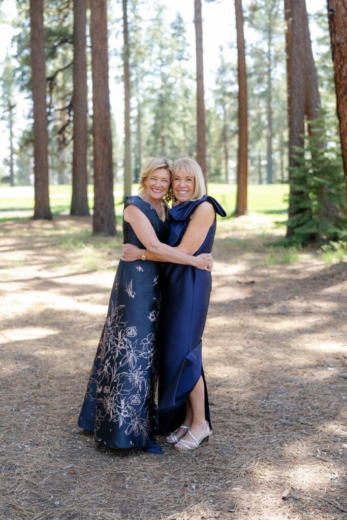 Mother of the bride portraits beneath the pine trees during an Edgewood Lot B wedding timeline.