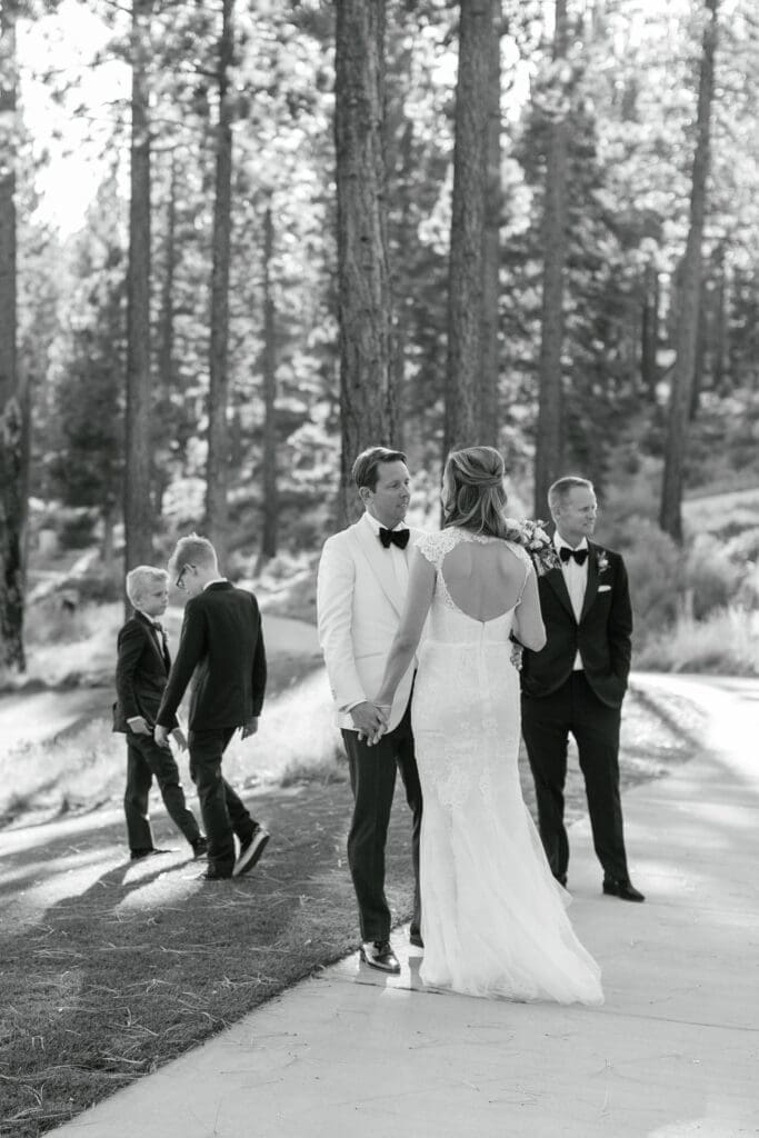 Bride and groom with family members following wedding ceremony at Martis Camp in Lake Tahoe