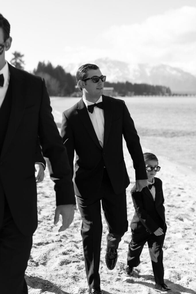 Guests walking along the shoreline during a Riva Grill wedding celebration in South Lake Tahoe.
