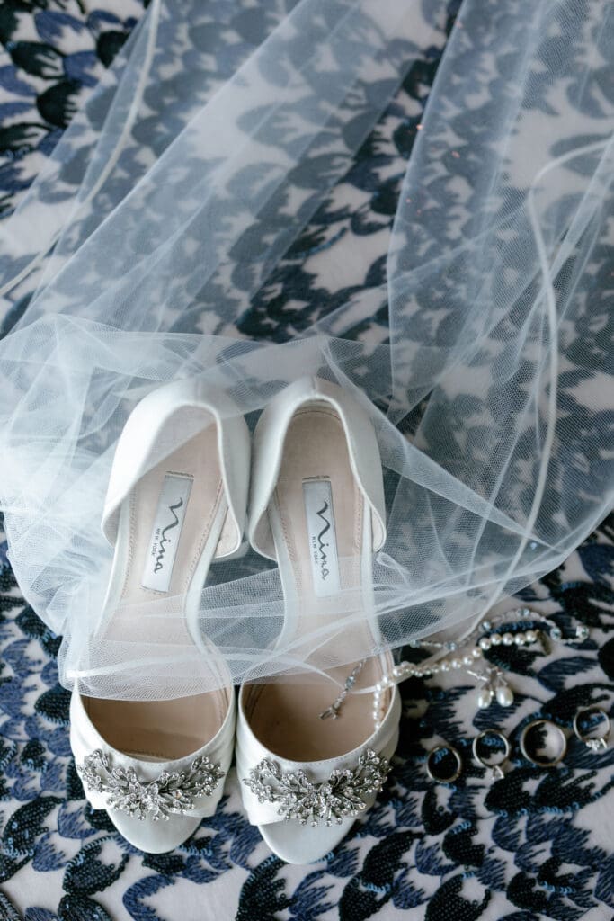 Luxury bridal shoes styled with veil and jewelry details during Thunderbird Lodge wedding preparations